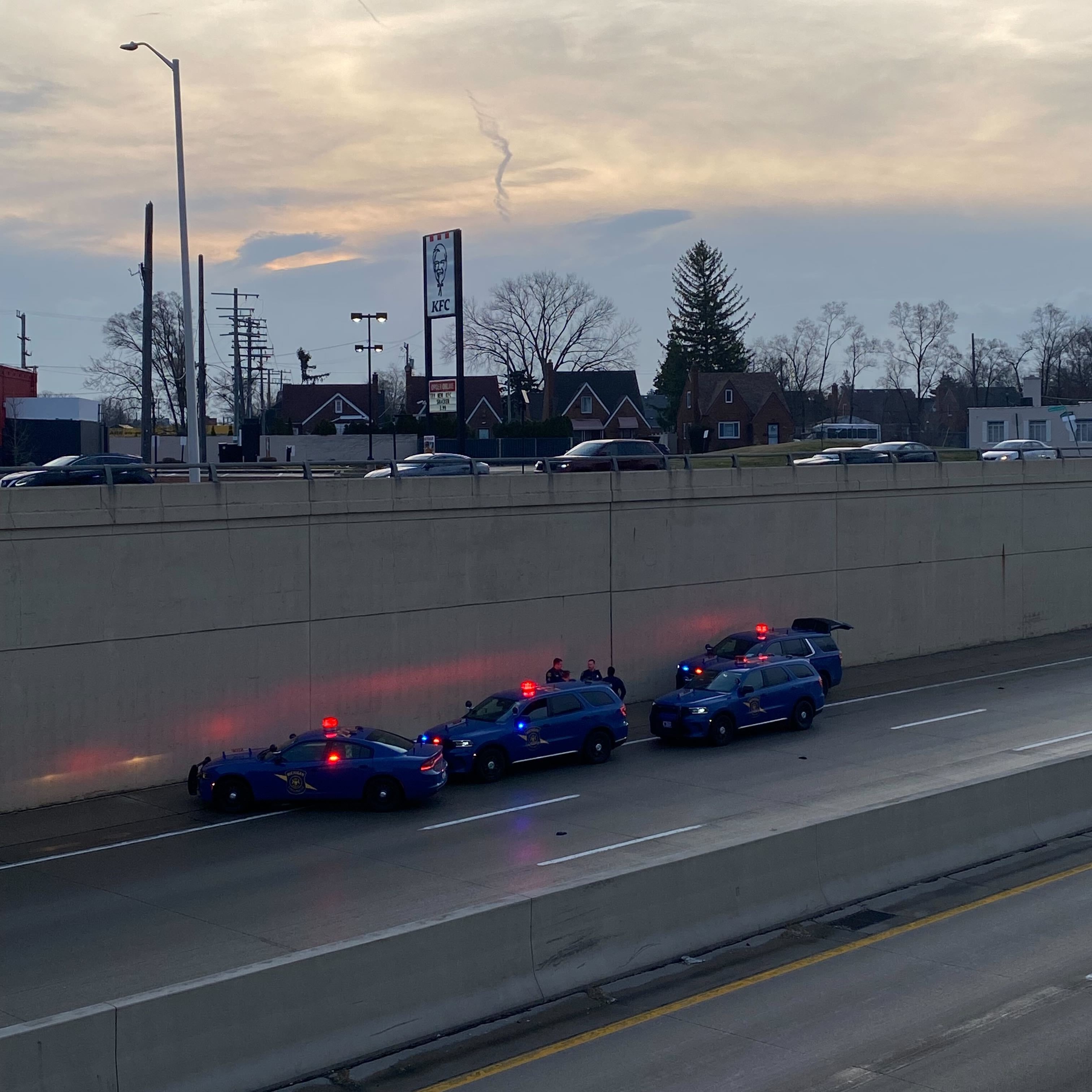 Ambulance crew finds body on side of Detroit freeway