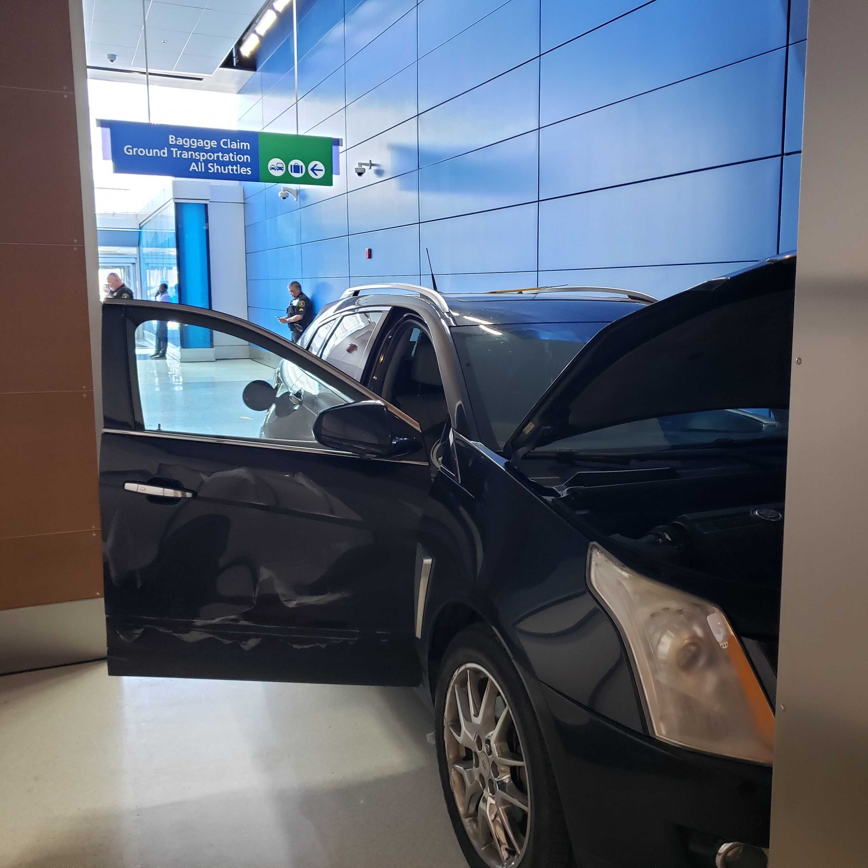 Man drives Cadillac into terminal at Detroit Metro Airport, arrested