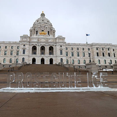 Far-right activist Jake Lang charged with bias crime after knocking down "Prosecute ICE" sculpture