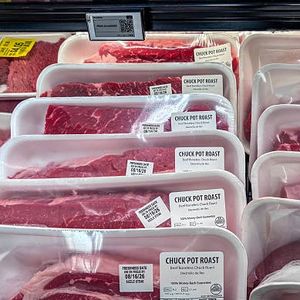 Inflation cooled last month as gas prices fell, though costs remain elevated