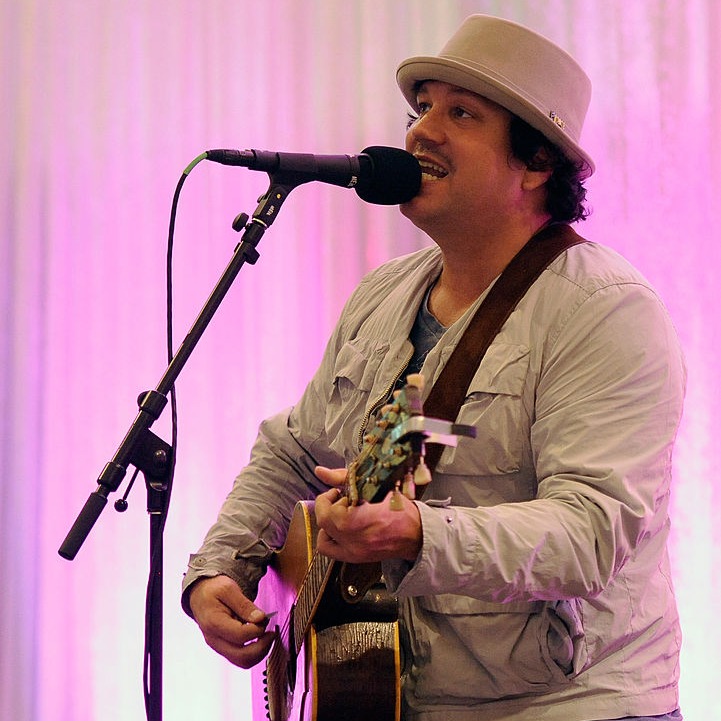 Tim Mahoney is getting ready to play guitar and sing between the rain drops at Target Field.