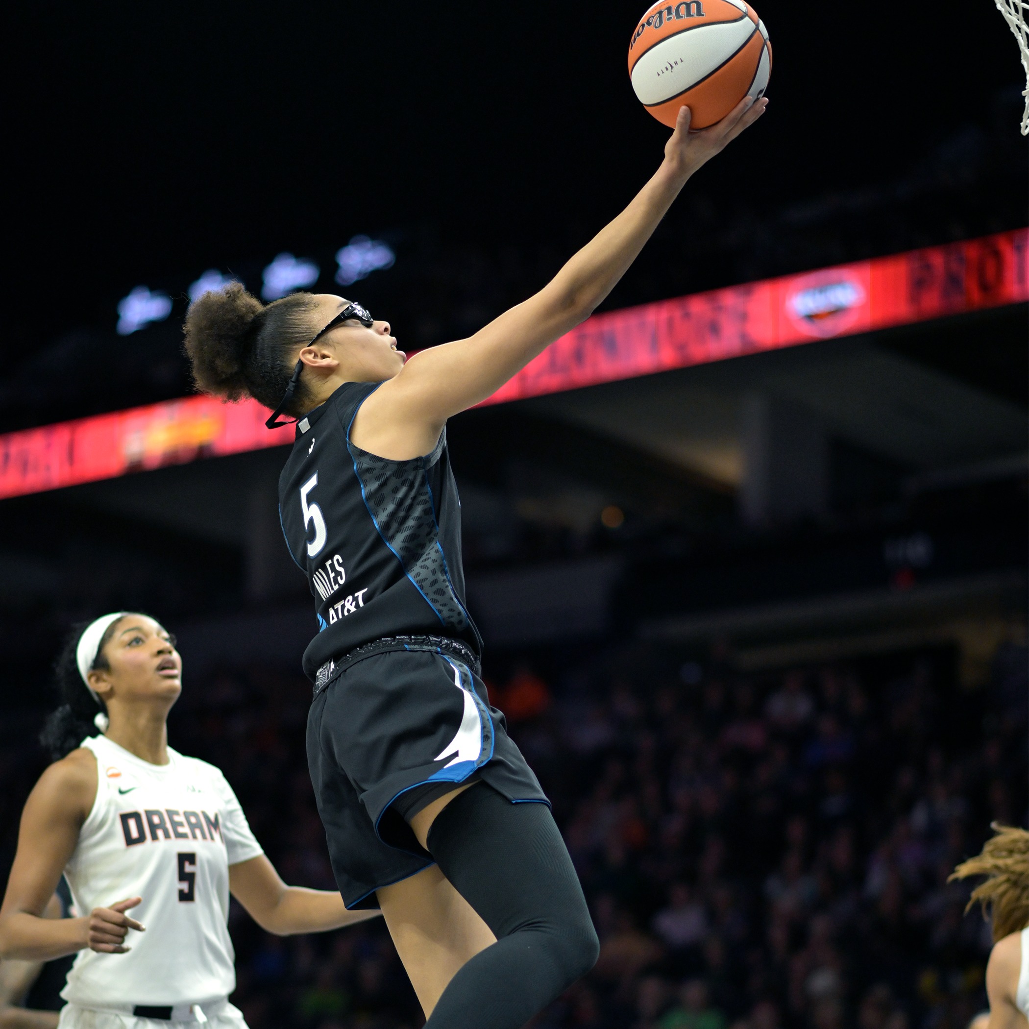 What impresses Charles Hallman about  Olivia Miles' game?