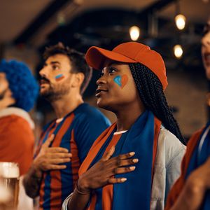Should women take their hats off for the National Anthem?