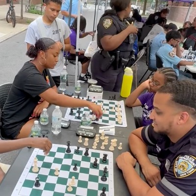 NYPD officers and Harlem youth face off in annual chess tournament