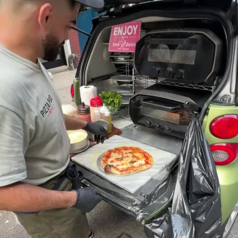 Smallest pizzeria in NYC is straight out of a trunk of a smart car