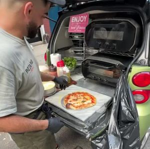 Smallest pizzeria in NYC is straight out of a trunk of a smart car