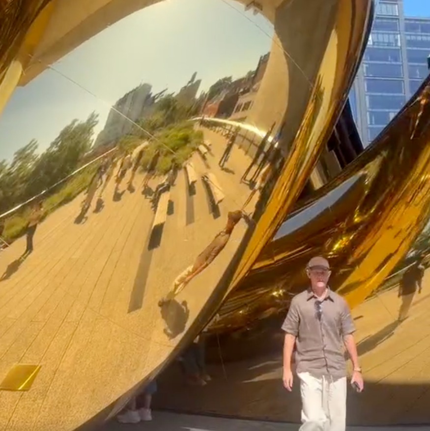Giant golden snake slithers onto NYC's High Line as part of fashion house installation