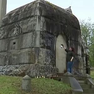 Volunteers clean cemetery that was the target of dozens of grave robberies