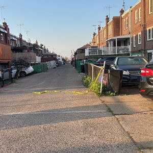 Philly police say man found in burning car had been shot to death