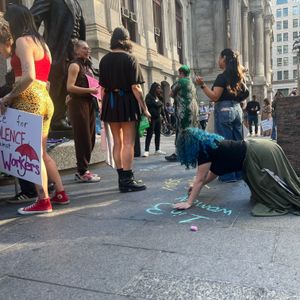 Dozens rally outside City Hall, demanding more from colleges to address sexual assault on campus