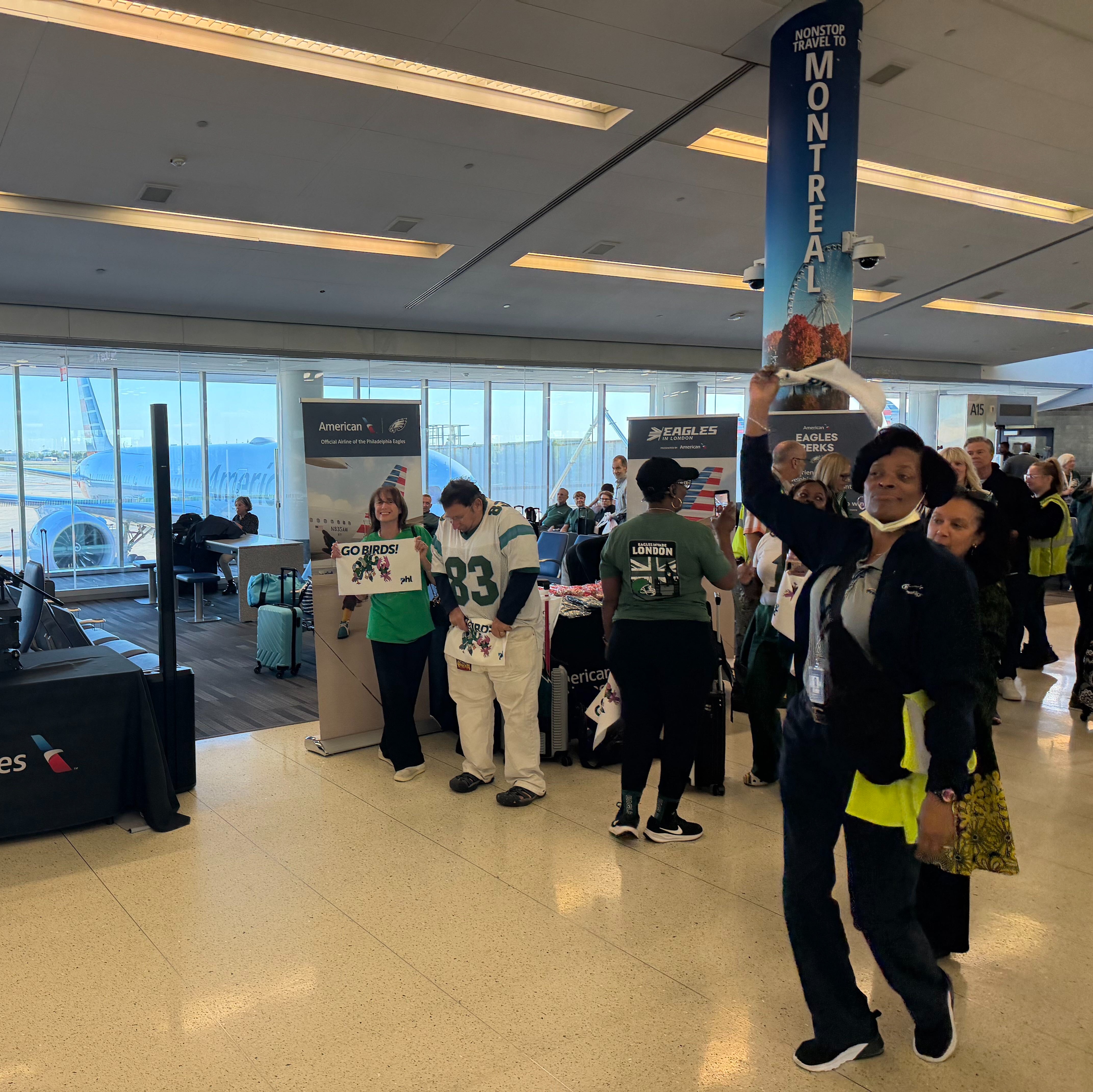 Eagles fans get a pep rally send off at the airport ahead of game in London