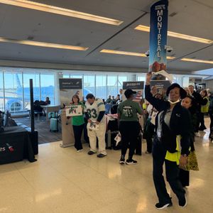 Eagles fans get a pep rally send off at the airport ahead of game in London
